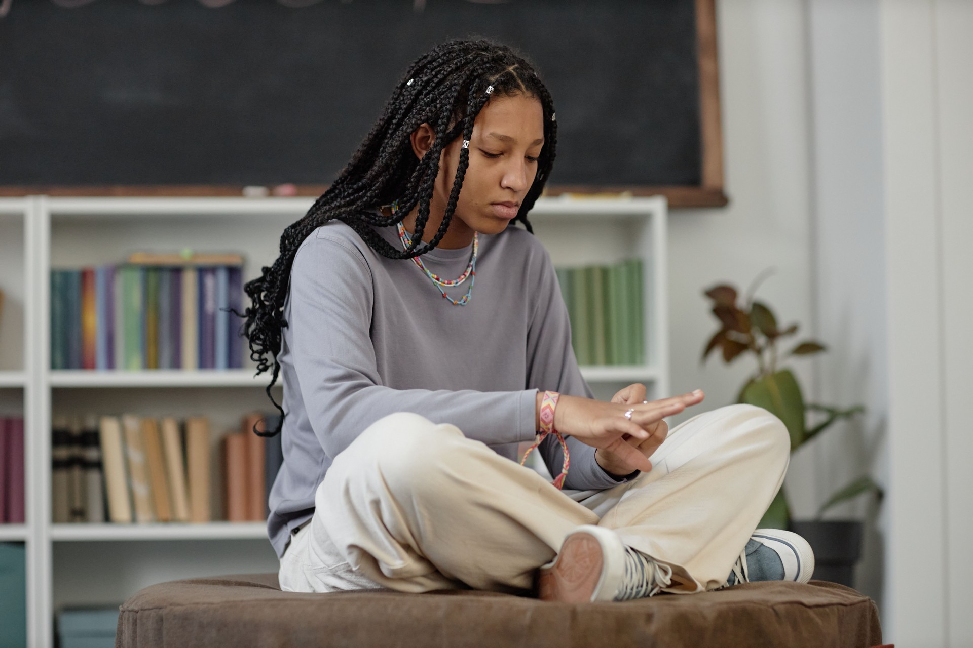 Black Teenage Girl in Library Lounge